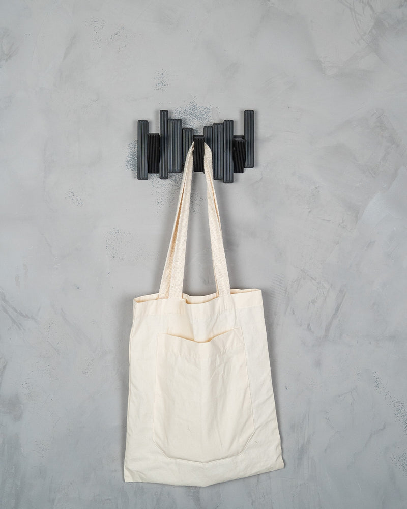 Modern Grid wall hooks holding a tote bag