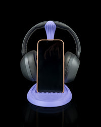 Flow Stand holding a phone on a lit base