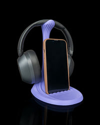 Sculpted headphone and phone stand with phone