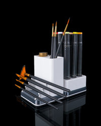 Art supply organizer holding brushes