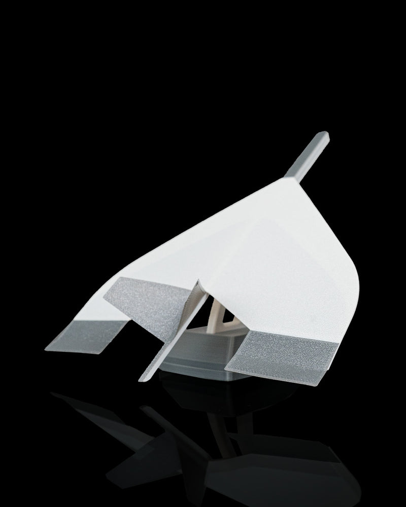 Stealth Dart jet glider plane on a display stand