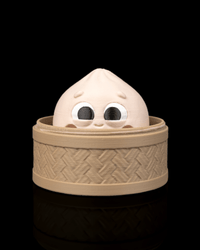 Cutie dumpling fidget in a bamboo steamer basket