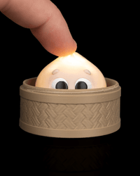 Finger pressing the cutie dumpling clicker