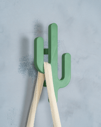 Cactus wall hooks holding a tote bag
