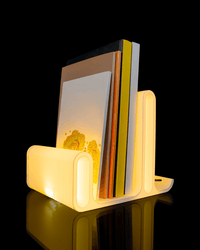 Glow Arc reading light with book and glasses
