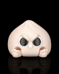 Grumpy Dumplin clicker fidget toy with an angry face