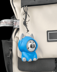 Hoodie Cat clipped to a bag as a keychain