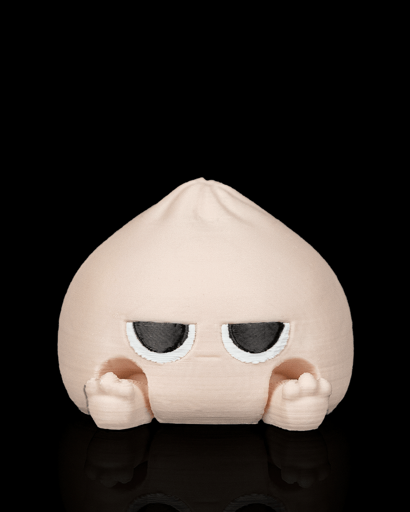 Meh Dumplin clicker fidget toy with an unbothered face
