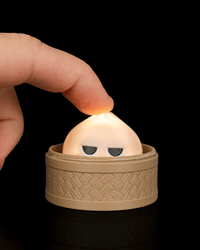 Finger pressing the meh dumpling clicker