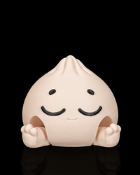 Snoozy Mega Dumplin clicker fidget toy with a sleepy face